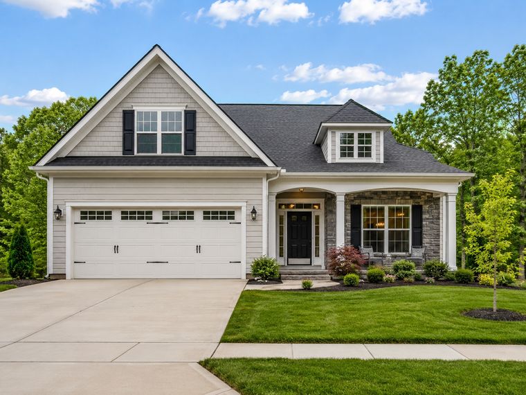 Single-family home with a two-car garage and covered front porch